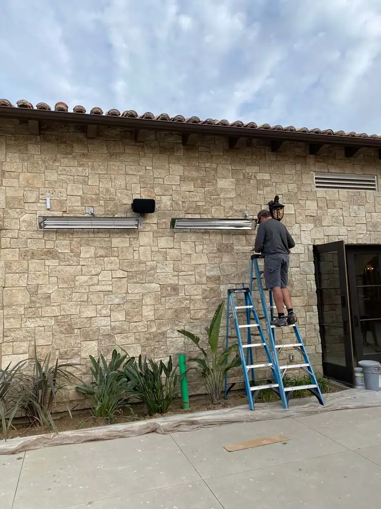 Patio heater being installed